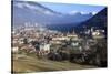 View of the city of Chur surrounded by woods and snowy peaks, district of Plessur, Canton of Graubu-Roberto Moiola-Stretched Canvas