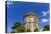 View of the city's landmark The White Tower, with Greek flag waving on top, Thessaloniki, Greece, E-null-Stretched Canvas