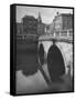 View of the Liffey River and the Metal Bridge in Dublin-Hans Wild-Framed Stretched Canvas