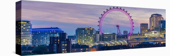 View of the London Eye and rooftop of Waterloo Station at dusk, Waterloo, London, England-Frank Fell-Stretched Canvas