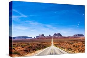 View of the Monument Valley and the Highway 163 in Utah during a Beautiful Summer Day. Vivid Blue S-offfstock-Stretched Canvas