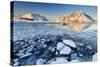 View of the Mountains of Gymsoya (Gimsoya) from Smorten Reflected in the Clear Partially Frozen Sea-Roberto Moiola-Stretched Canvas