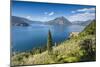 View of the typical village of Varenna and Lake Como surrounded by mountains, Italian Lakes, Italy-Roberto Moiola-Mounted Photographic Print