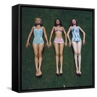 View of Three Unidentified Women in Bathing Suits as They Sunbath on Green Grass, 1961-Allan Grant-Framed Stretched Canvas