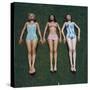 View of Three Unidentified Women in Bathing Suits as They Sunbath on Green Grass, 1961-Allan Grant-Stretched Canvas