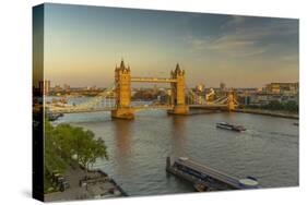 View of Tower Bridge and River Thames from Cheval Three Quays at sunset, London, England-Frank Fell-Stretched Canvas