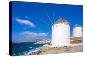 View of windmills and town in background, Mykonos Town, Mykonos, Cyclades Islands, Aegean Sea-Frank Fell-Stretched Canvas