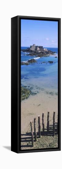 View of Wooden Posts on the Beach with a Fort in the Background, St-Malo, Brittany, France-null-Framed Stretched Canvas