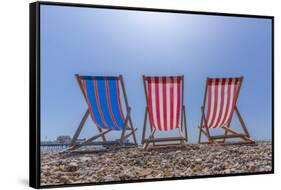 View of Worthing Pier and colourful deckchairs on Worthing Beach, Worthing, West Sussex, England-Frank Fell-Framed Stretched Canvas