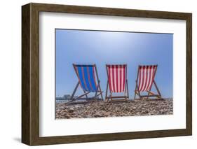 View of Worthing Pier and colourful deckchairs on Worthing Beach, Worthing, West Sussex, England-Frank Fell-Framed Photographic Print