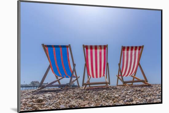 View of Worthing Pier and colourful deckchairs on Worthing Beach, Worthing, West Sussex, England-Frank Fell-Mounted Photographic Print