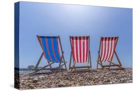 View of Worthing Pier and colourful deckchairs on Worthing Beach, Worthing, West Sussex, England-Frank Fell-Stretched Canvas
