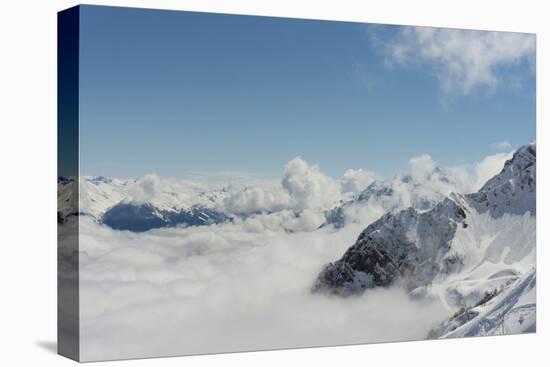 View on Winter Snowy Mountains and Blue Sky above Clouds, Krasnaya Polyana, Sochi, Russia-wasja-Stretched Canvas