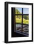 View out a window toward a cabin nestled in the hills of the Austrian Alps-Sheila Haddad-Framed Photographic Print