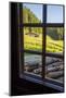 View out a window toward a cabin nestled in the hills of the Austrian Alps-Sheila Haddad-Mounted Photographic Print