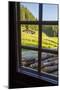 View out a window toward a cabin nestled in the hills of the Austrian Alps-Sheila Haddad-Mounted Photographic Print