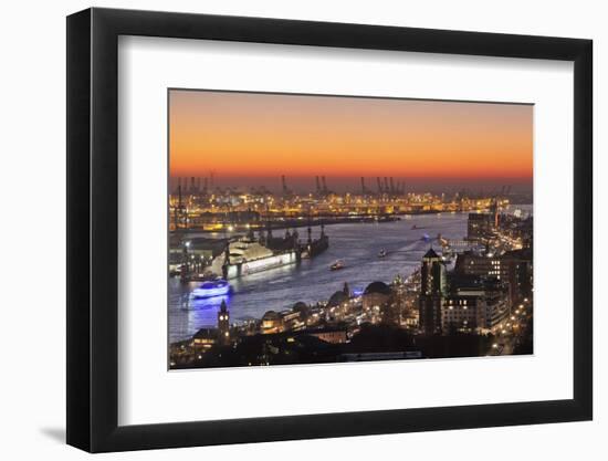 View over St. Pauli district and St. Pauli Landungsbruecken pier over the harbour at sunset, Hambur-Markus Lange-Framed Premium Photographic Print