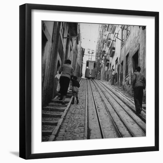 View Showing a Typical Street Scene in Lisbon-Bernard Hoffman-Framed Photographic Print