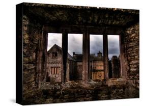 View Through a Stone Window of Ruined Castle-Clive Nolan-Stretched Canvas