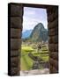 View Through Window of Ancient Lost City of Inca, Machu Picchu, Peru, South America with Llamas-Miva Stock-Stretched Canvas