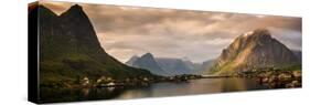 Village and fjord among mountains, Reine, Moskenesoya, Lofoten, Nordland County, Norway-null-Stretched Canvas