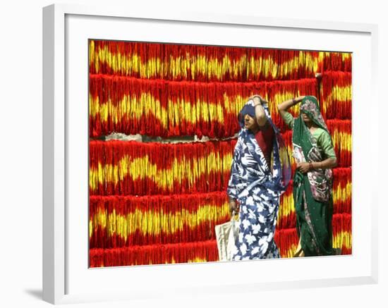 Villagers Walk Past Freshly Dyed Kalawa, a Sacred Orange-Yellow Thread Used in Hindu Rituals-null-Framed Photographic Print