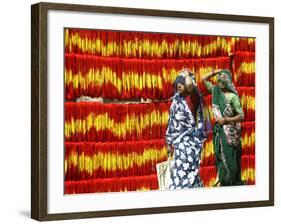 Villagers Walk Past Freshly Dyed Kalawa, a Sacred Orange-Yellow Thread Used in Hindu Rituals-null-Framed Photographic Print