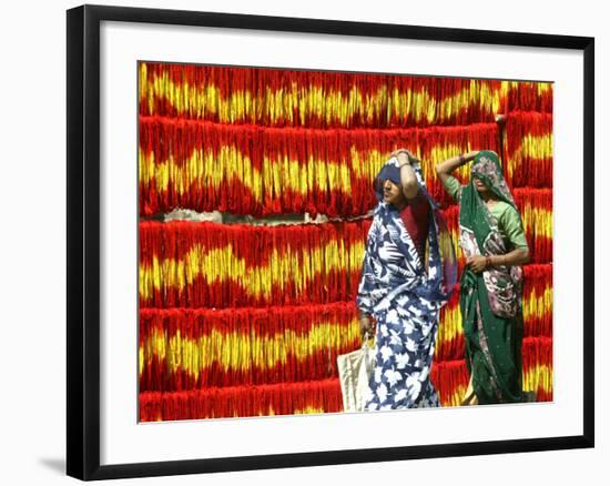 Villagers Walk Past Freshly Dyed Kalawa, a Sacred Orange-Yellow Thread Used in Hindu Rituals-null-Framed Photographic Print