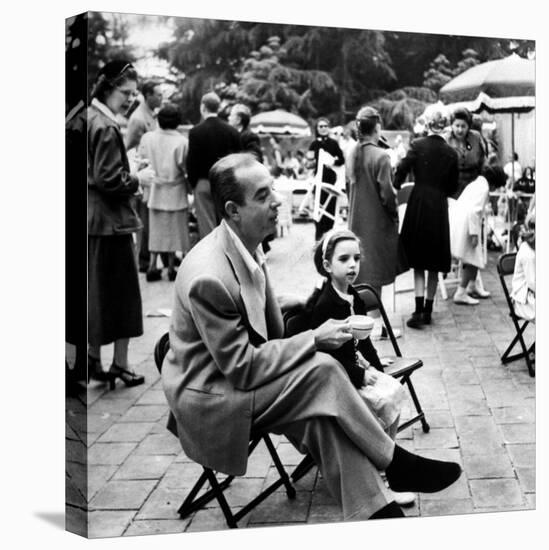 Vincente Minnelli with coffee sitting in chair with Daughter Liza at Outdoor Children's Party Being-J^ R^ Eyerman-Stretched Canvas