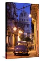 Vintage American Car Parked on Floodlit Street with the Capitolio in the Background-Lee Frost-Stretched Canvas