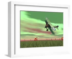 Vintage Biplane Flying Above Green Grass with Flowers by Sunset-null-Framed Art Print