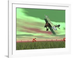 Vintage Biplane Flying Above Green Grass with Flowers by Sunset-null-Framed Art Print