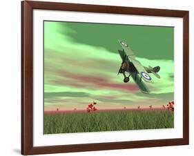 Vintage Biplane Flying Above Green Grass with Flowers by Sunset-null-Framed Art Print