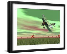 Vintage Biplane Flying Above Green Grass with Flowers by Sunset-null-Framed Art Print