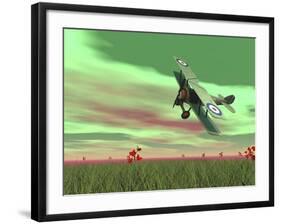 Vintage Biplane Flying Above Green Grass with Flowers by Sunset-null-Framed Art Print