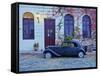 Vintage car on the cobblestone lane of the historic quarter, Colonia del Sacramento, Colonia Depart-Karol Kozlowski-Framed Stretched Canvas