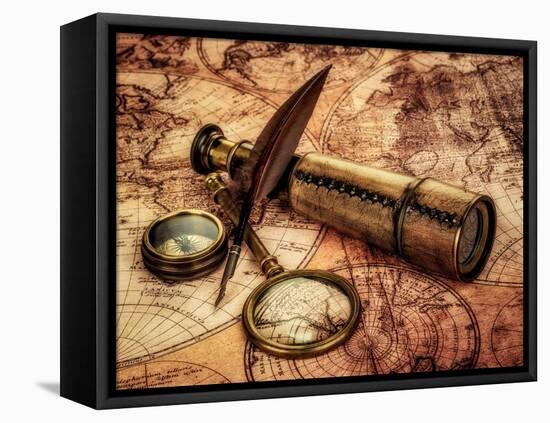 Vintage Magnifying Glass, Compass, Goose Quill Pen And Spyglass Lying On An Old Map-Andrey Armyagov-Framed Stretched Canvas