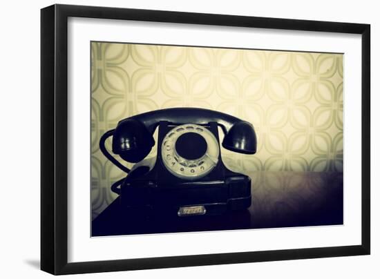 Vintage Old Telephone, Black Retro Phone Is On Wooden Table Over Green Old-Fashioned Wallpaper-khorzhevska-Framed Art Print