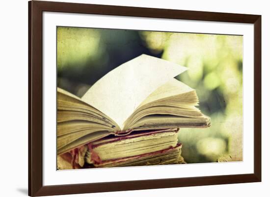 Vintage Photo of Old Books on Colorful Bokeh Background-melis-Framed Photographic Print