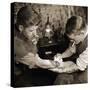 Vintage Shot of a Man Being Tattooed-null-Stretched Canvas