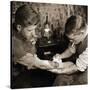 Vintage Shot of a Man Being Tattooed-null-Stretched Canvas