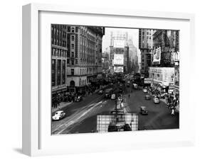 Visitors and Residents of New York City Spend Their Time Window-Shopping Around the Times Square-null-Framed Premium Photographic Print