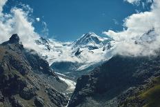 Snow Capped Alpine Mountains. Trek near Matterhorn Mount. View of the Mountain and Valley of a Moun-vitaliymateha-Stretched Canvas