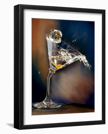 Vodka Martini Spilling from a Bent Martini Glass with Ice Cube-Jeff Sarpa-Framed Photographic Print