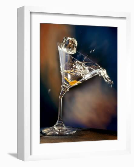 Vodka Martini Spilling from a Bent Martini Glass with Ice Cube-Jeff Sarpa-Framed Photographic Print