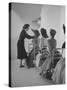 Vogue Magazine Editor Bettina Ballard Directing and prepping models for Photo Shoot at Studio-Nat Farbman-Stretched Canvas