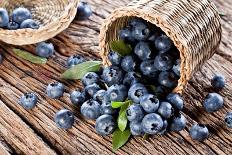 Blueberries Have Dropped from the Basket on an Old Wooden Table.-Volff-Stretched Canvas