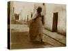 Voyage en Algérie : femme marchant dans une rue de Biskra-Henri Jacques Edouard Evenepoel-Stretched Canvas