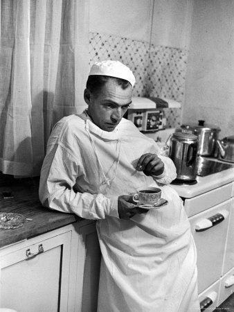 Dr. Ernest Ceriani in a State of Exhaustion, Having a Cup of Coffee in the Hospital Kitchen at 2 AM