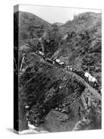 Wagon Train on Mountain Pass-null-Stretched Canvas